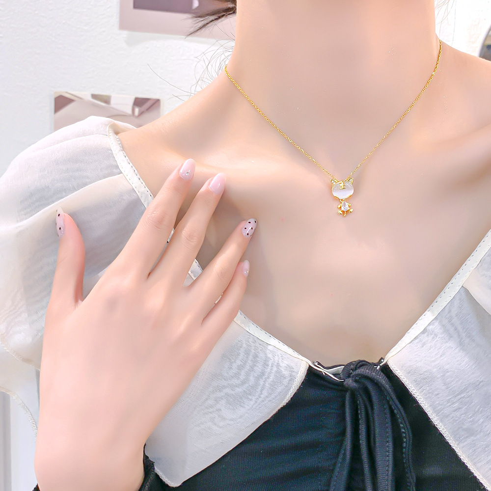 Japanese and Korean light luxury design sense cat's eye stone little tiger pendant titanium steel necklace, exquisite zircon high-end collarbone chain for women Application Scenario