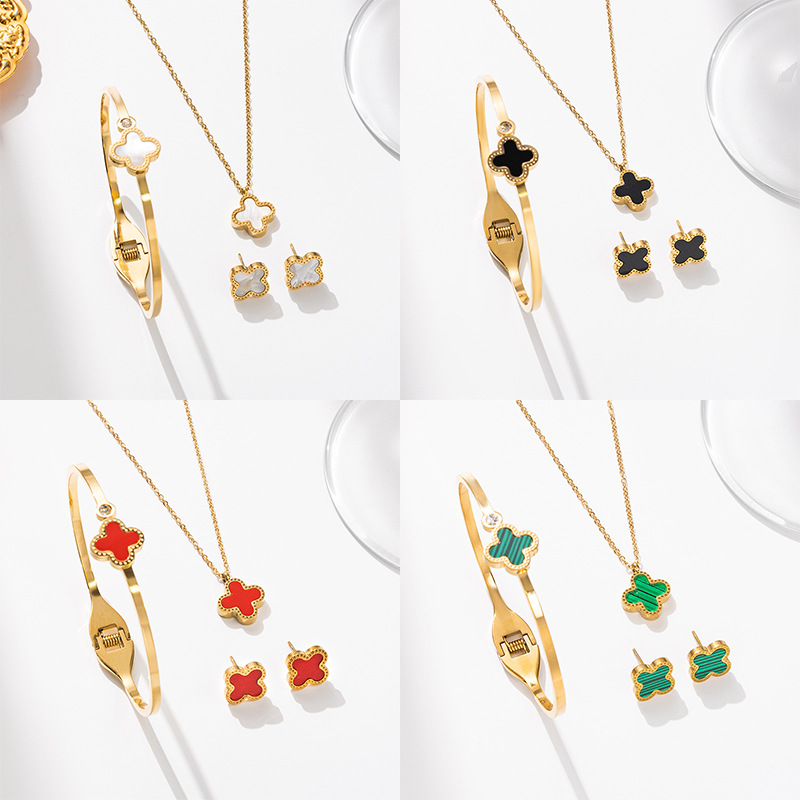 Wholesale of cross-border electroplated 18k gold stainless steel four-leaf clover set, fashionable and versatile necklace, bracelet and stud three-piece set full figure