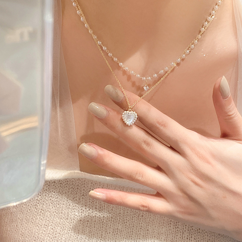Korean niche pearl double-layer titanium steel necklace, female personality cat's eye stone heart pendant, fresh and sweet collarbone chain details Picture