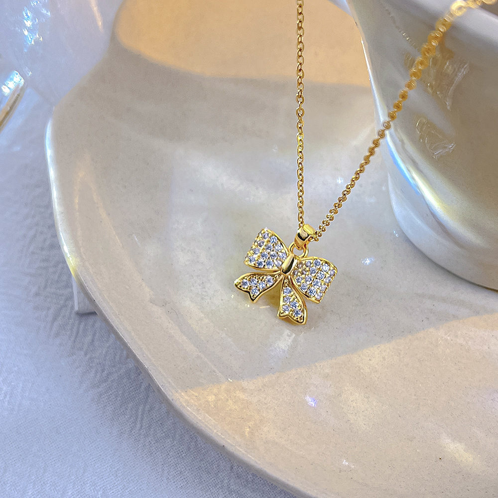 Fashionable and light luxury golden bow titanium steel necklace, women's Instagram trendy collarbone pendant, versatile and elegant accessories wholesale Specification drawing