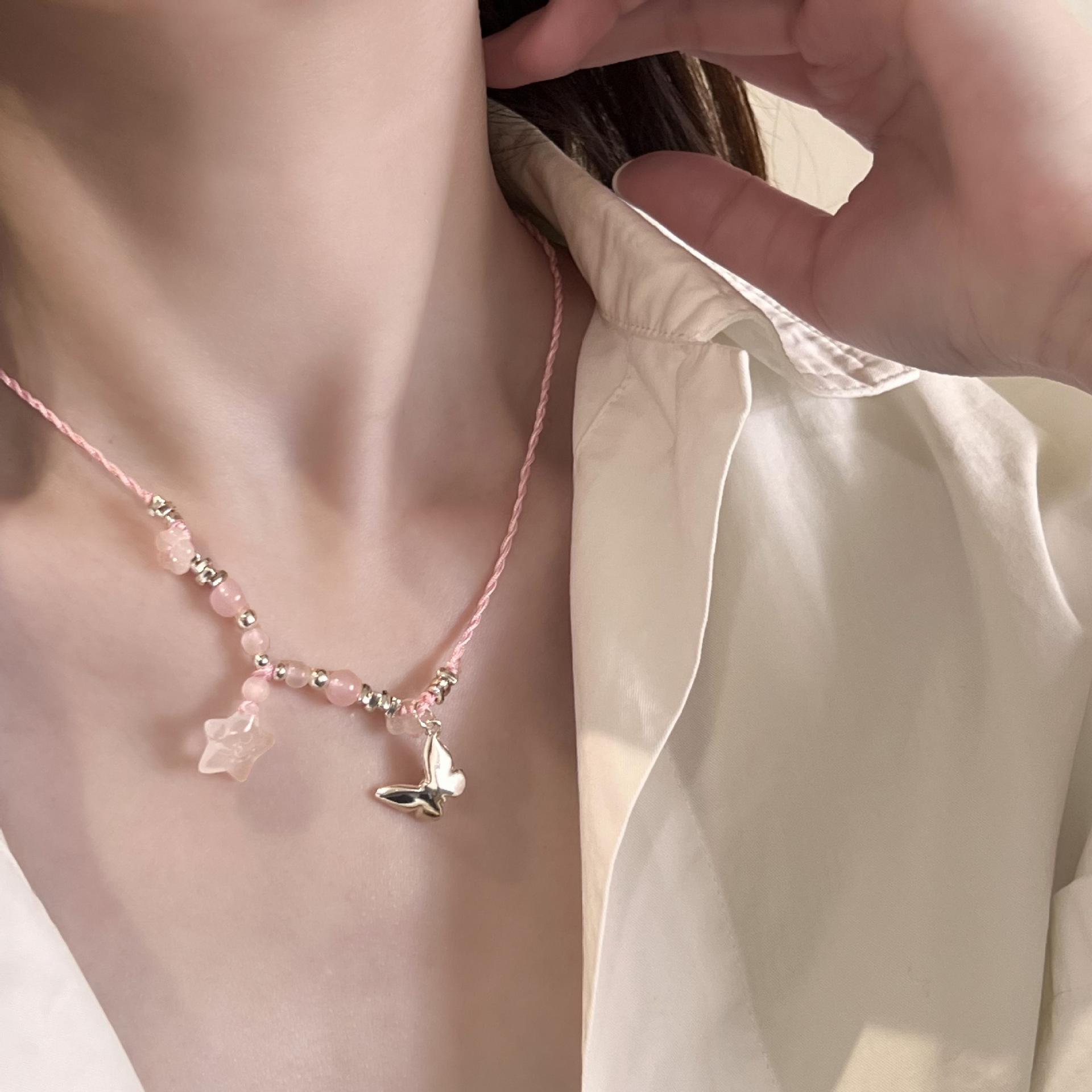 Youqianhua's niche design ice Transparent star woven rope necklace, broken silver butterfly collarbone chain, fashionable and light luxury necklace full figure