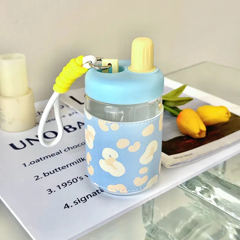 A popular online celebrity girl's glass cup for direct drinking, with a high level of appearance and freshness. It's a portable, heat-insulating leather case water cup gift for female students Application Scenario