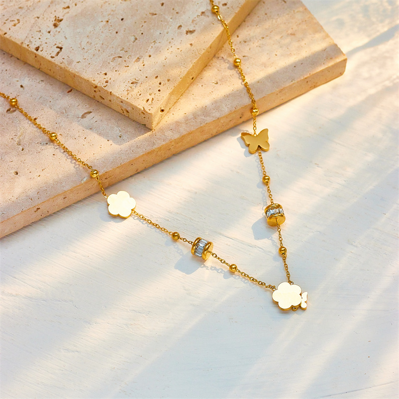 European and American fashion niche shell black and white butterfly small flower tassel necklace, high-end and elegant titanium steel collarbone chain details Picture