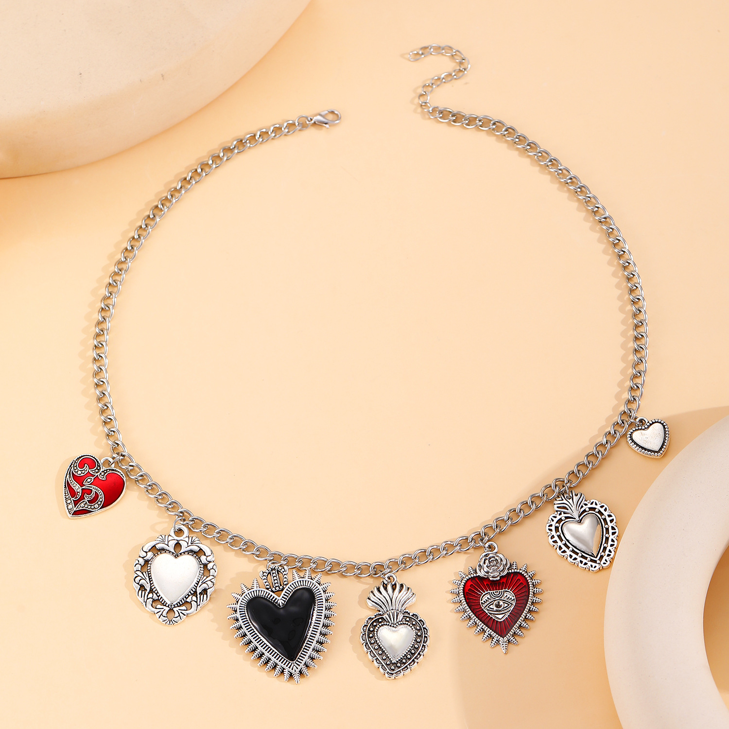 European and American cross-border exaggerated personality retro religious multiple sacred heart pendant necklace earrings for women, silver design sense heart Specification drawing