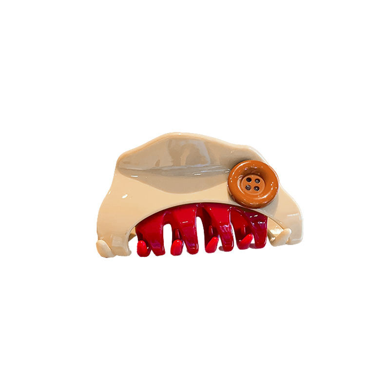 The designer's button gripper is fashionable and elegant. It features a red triangular hairpin, a color-blocked hairpin, and a half-tied shark clip Item Picture