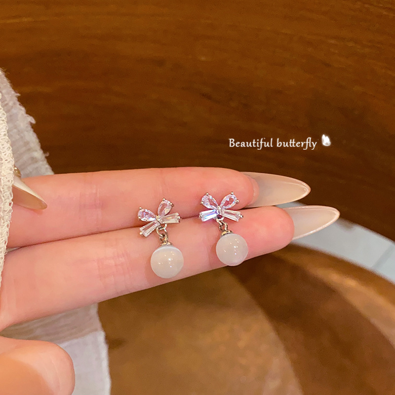 Sweet and elegant bow tassel earrings, women's fashion and high-end sense, light luxury cat's eye stone earrings, exquisite zircon earrings full figure