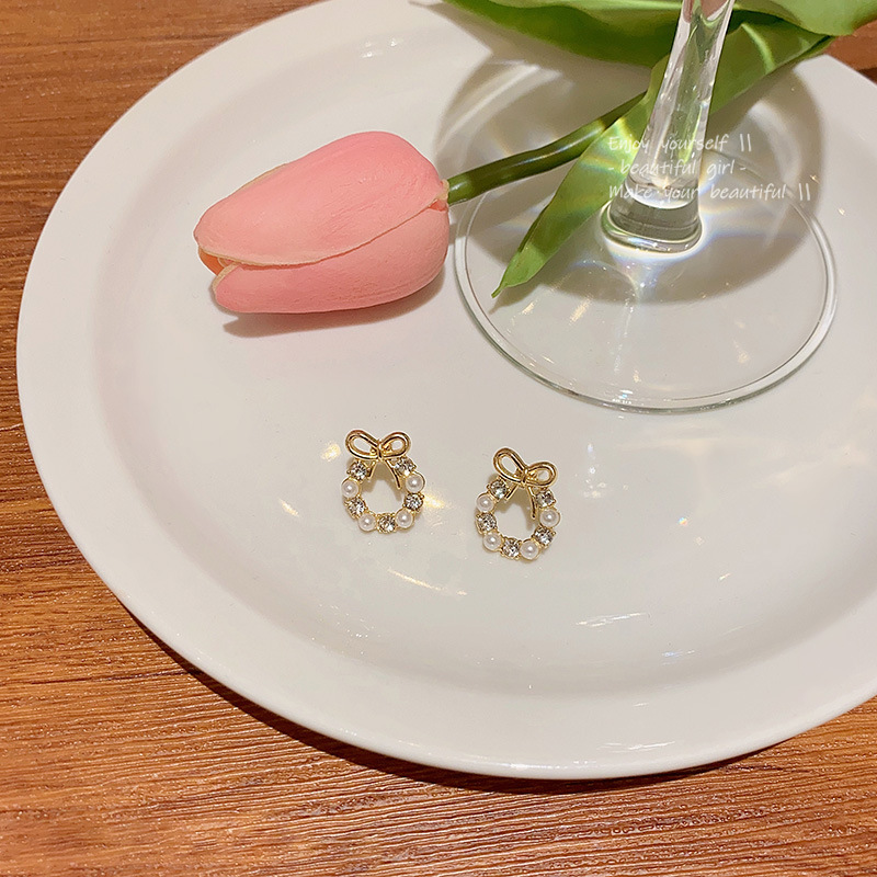 Light luxury and high-end bow earrings for women, simple Korean style pearl stud earrings, diamond-encrusted zircon versatile earrings wholesale Application Scenario