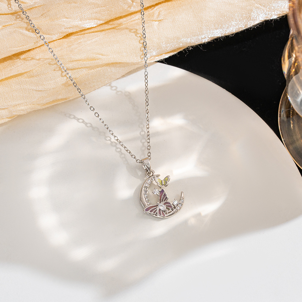 A new innovative design dual-color moon butterfly pendant titanium steel necklace with a feminine, light luxury style and a niche collarbone chain full figure