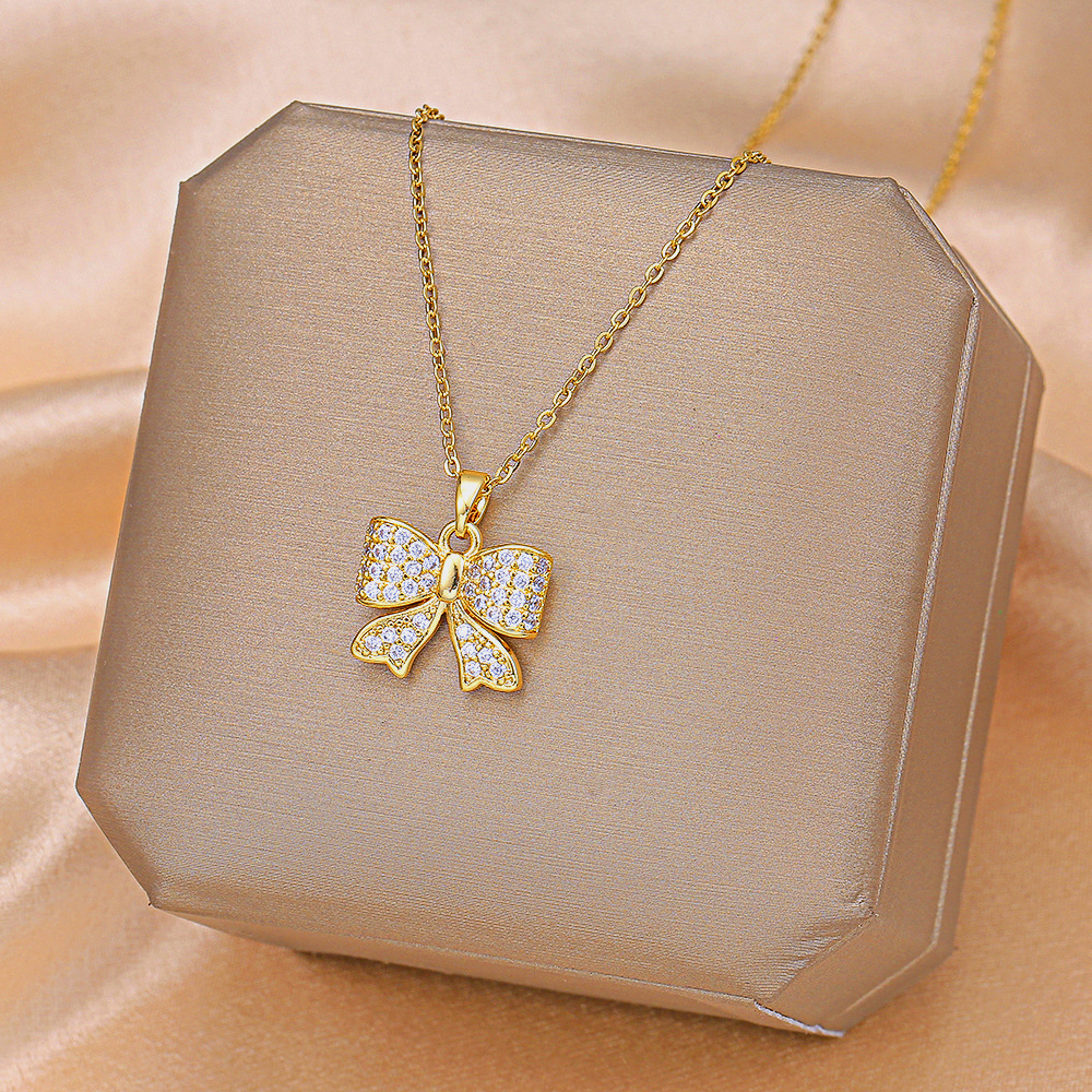 Fashionable and light luxury golden bow titanium steel necklace, women's Instagram trendy collarbone pendant, versatile and elegant accessories wholesale full figure