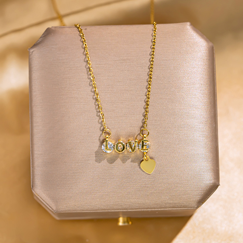 "love letter diamond-encrusted titanium steel necklace, women's heart-shaped tassel pendant, niche internet-famous light luxury collarbone chain accessory wholesale. full figure