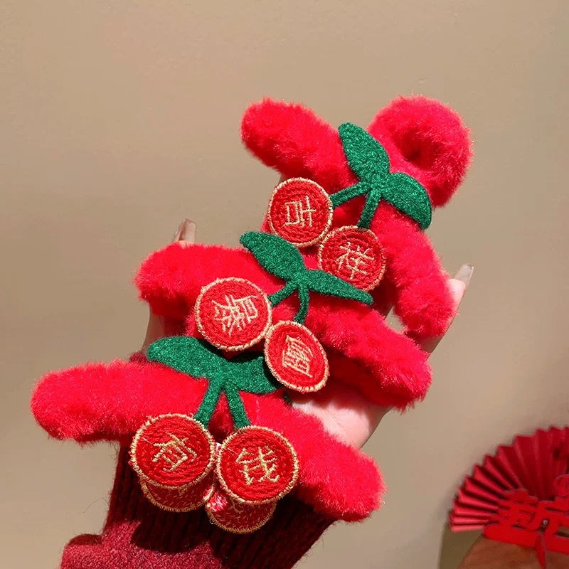 A red New Year plush hair clip on the back of a woman's head, symbolizing sudden wealth. It features a half-hair bun and a shark clip headpiece for the Year of the Snake full figure