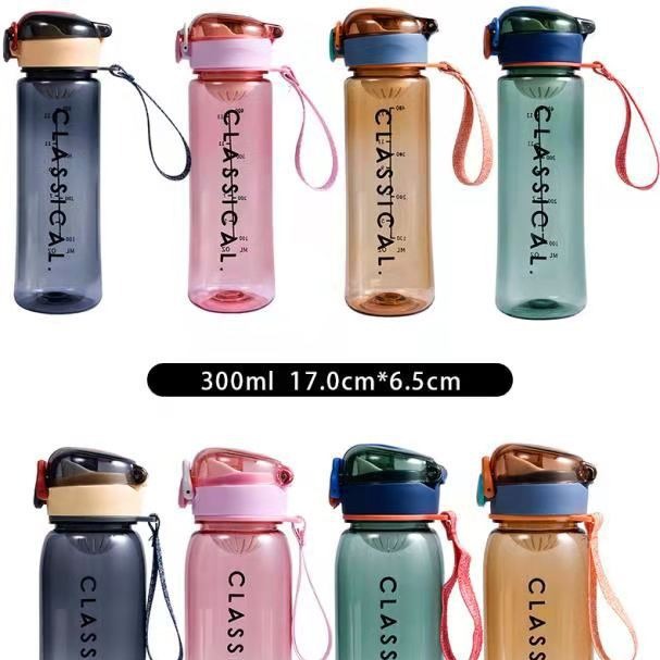 The new Korean version of the bouncy plastic cup is a cute and fashionable water cup with a large capacity for children's outdoor sports, a strappy lock lid Item Picture