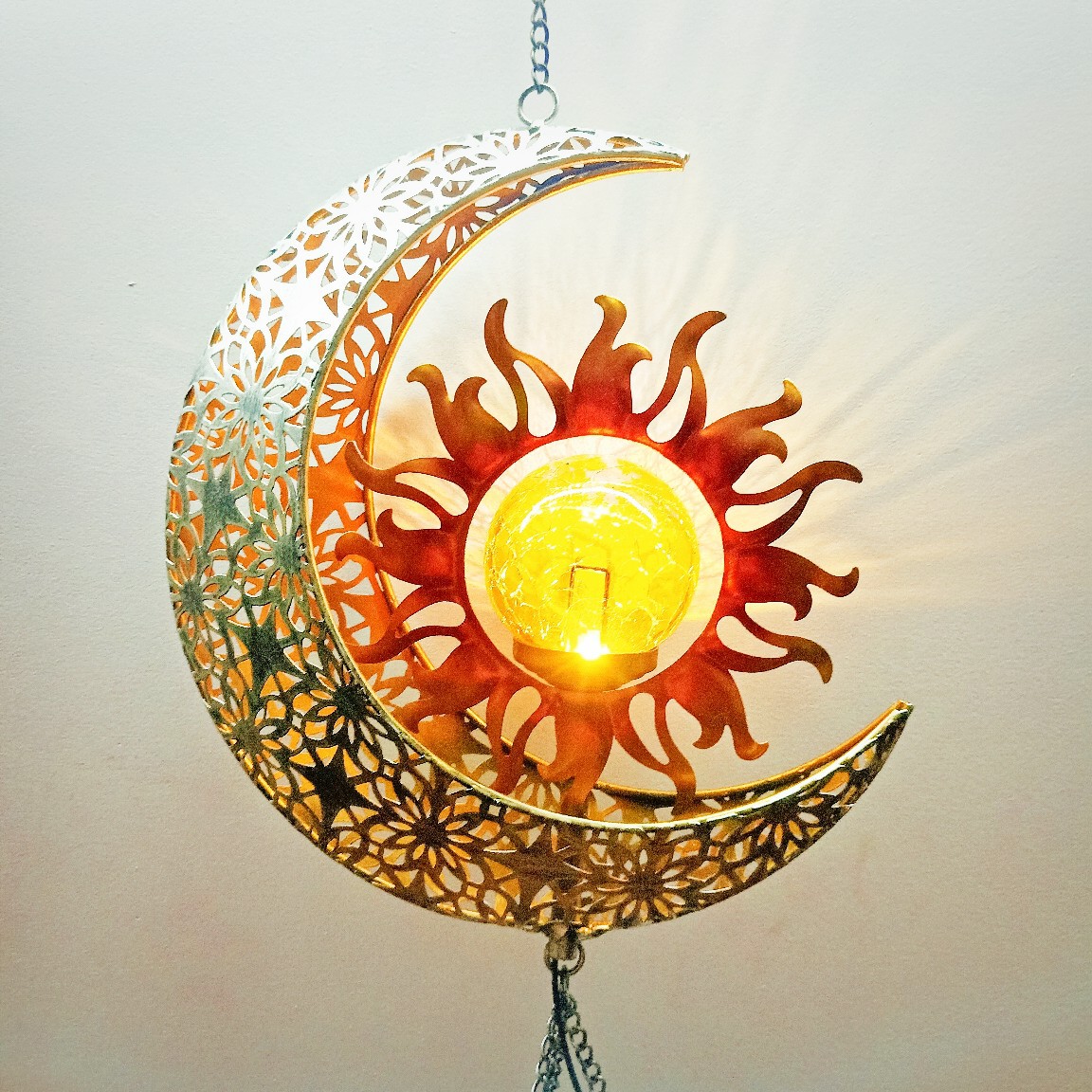 Amazon's new ironwork led solar energy sun moon wind bell pendant is in stock at the factory details Picture