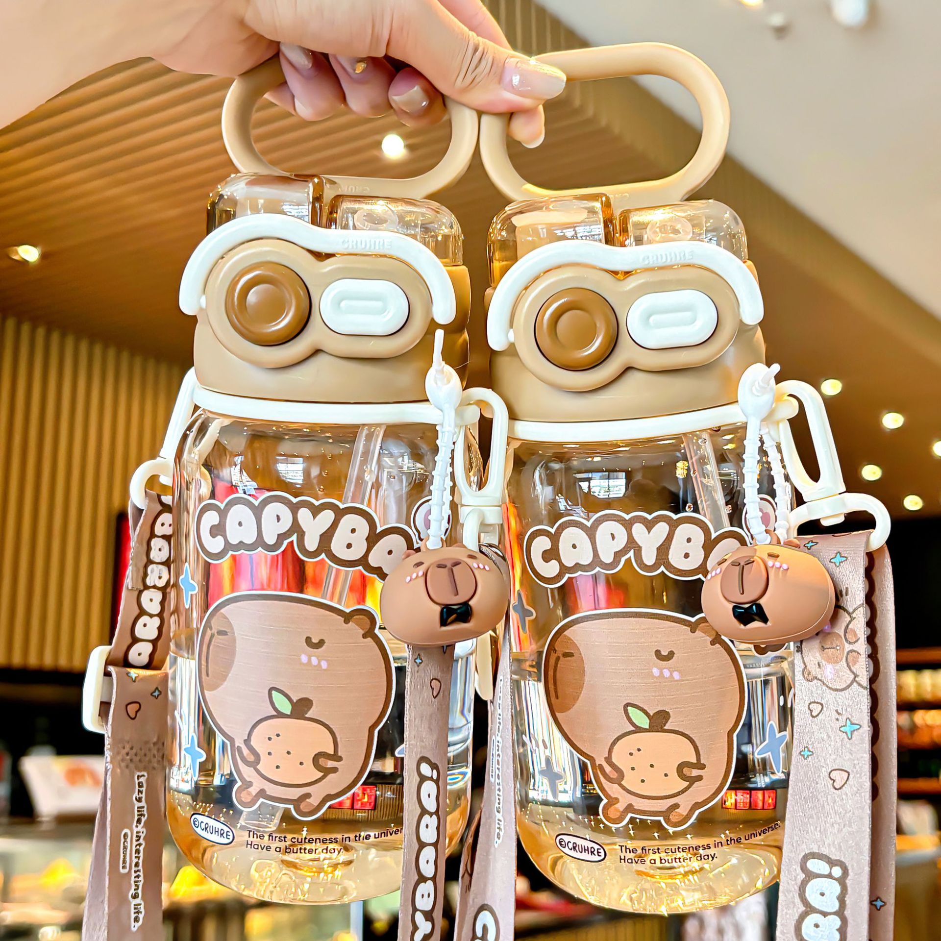 The 2025 new Capibara children's water cup is a cute, large-capacity, double-drinking cup with a lock, convenient handle and straw Application Scenario