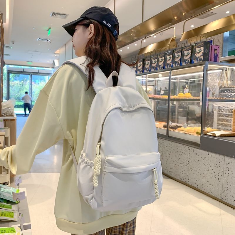 Large-capacity casual schoolbag for college students, ins Korean version, solid color backpack for middle and high school students, simple and versatile backpack Application Scenario