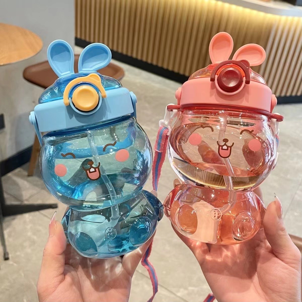 Best-selling cute little rabbit children's outdoor sports water bottle, cartoon large-capacity plastic water cup with shoulder strap straw cup full figure