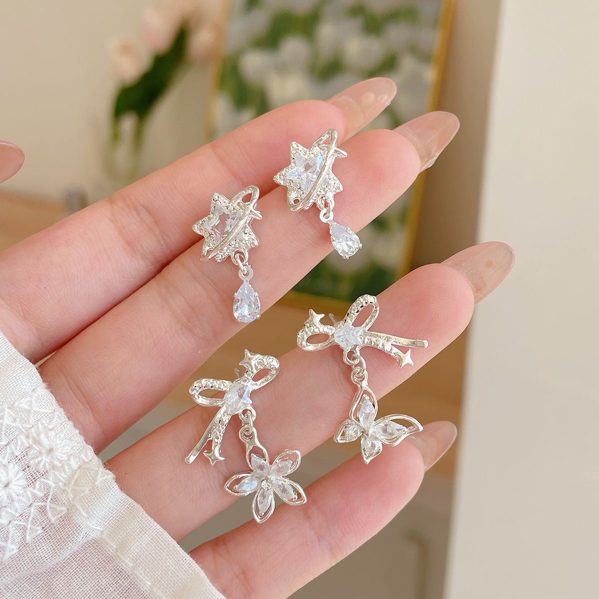 Korean version zircon bow star earrings, women's silver needle, niche design, simple and exquisite, versatile, light luxury earrings full figure