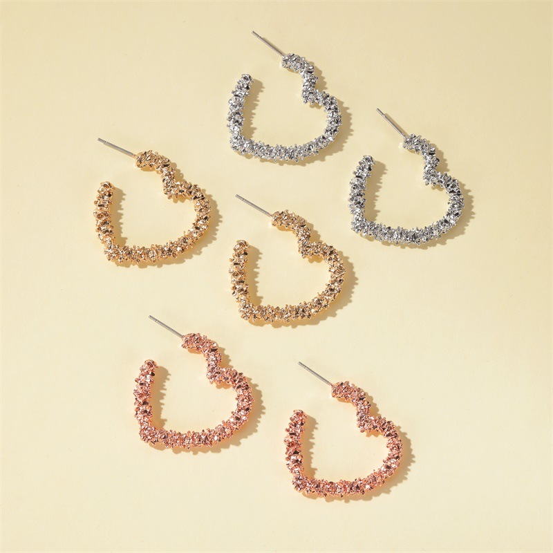 European and American cross-border earrings with silver fragments, elegant carved open heart-shaped earrings, simple alloy frosted heart-shaped stud earrings details Picture