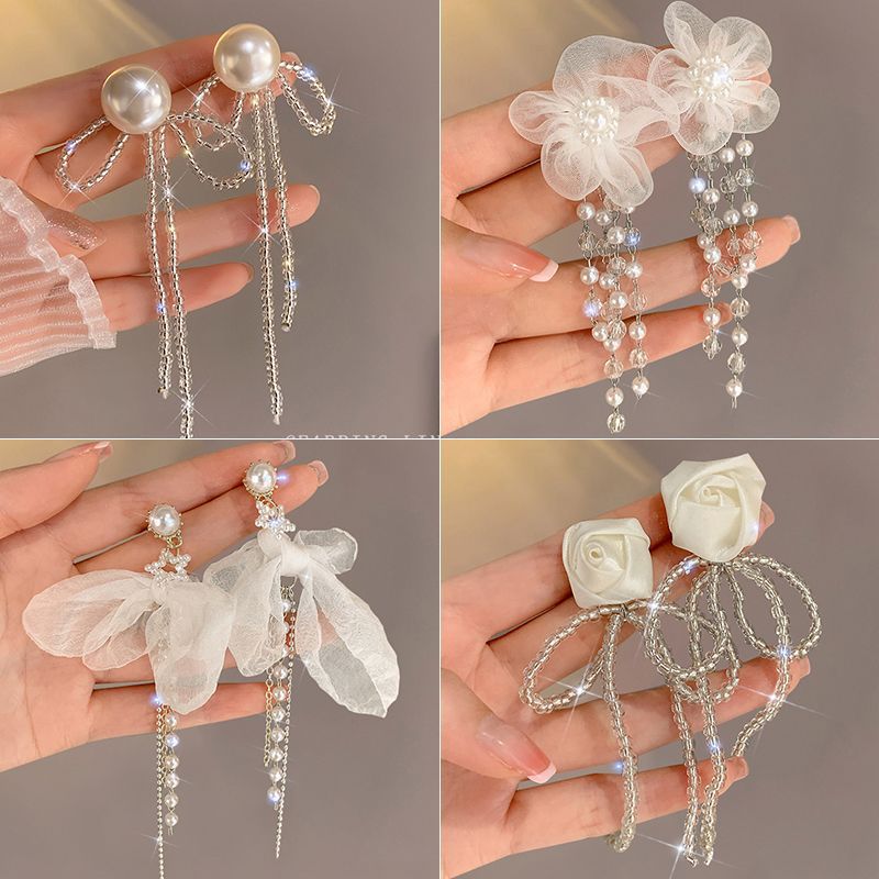Super fairy-like bow tassel stud earrings for women, a new 2024 trendy, niche and high-end style earring, a best-selling accessory full figure