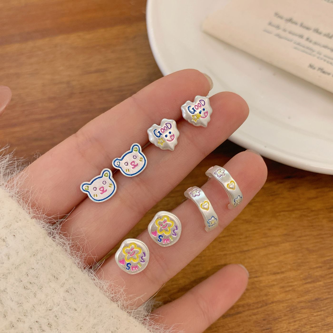 Spring 2025 Colorful hand-painted smiling face flower silver stud earrings, silver needle girl cartoon bear fun student earrings details Picture