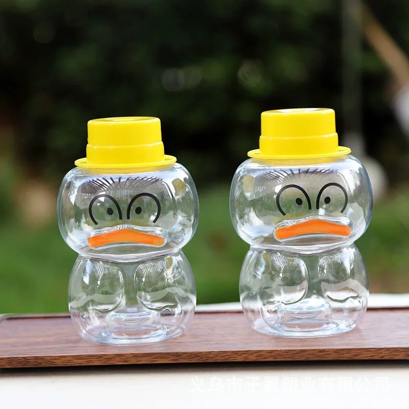 The manufacturer is selling a new type of cute summer little yellow duck juice drink milk tea cup, a popular PET cold drink cup with a lid Specification drawing