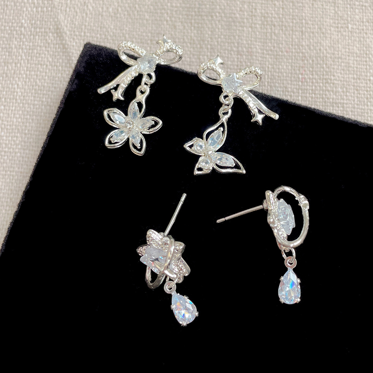 Korean version zircon bow star earrings, women's silver needle, niche design, simple and exquisite, versatile, light luxury earrings Specification drawing