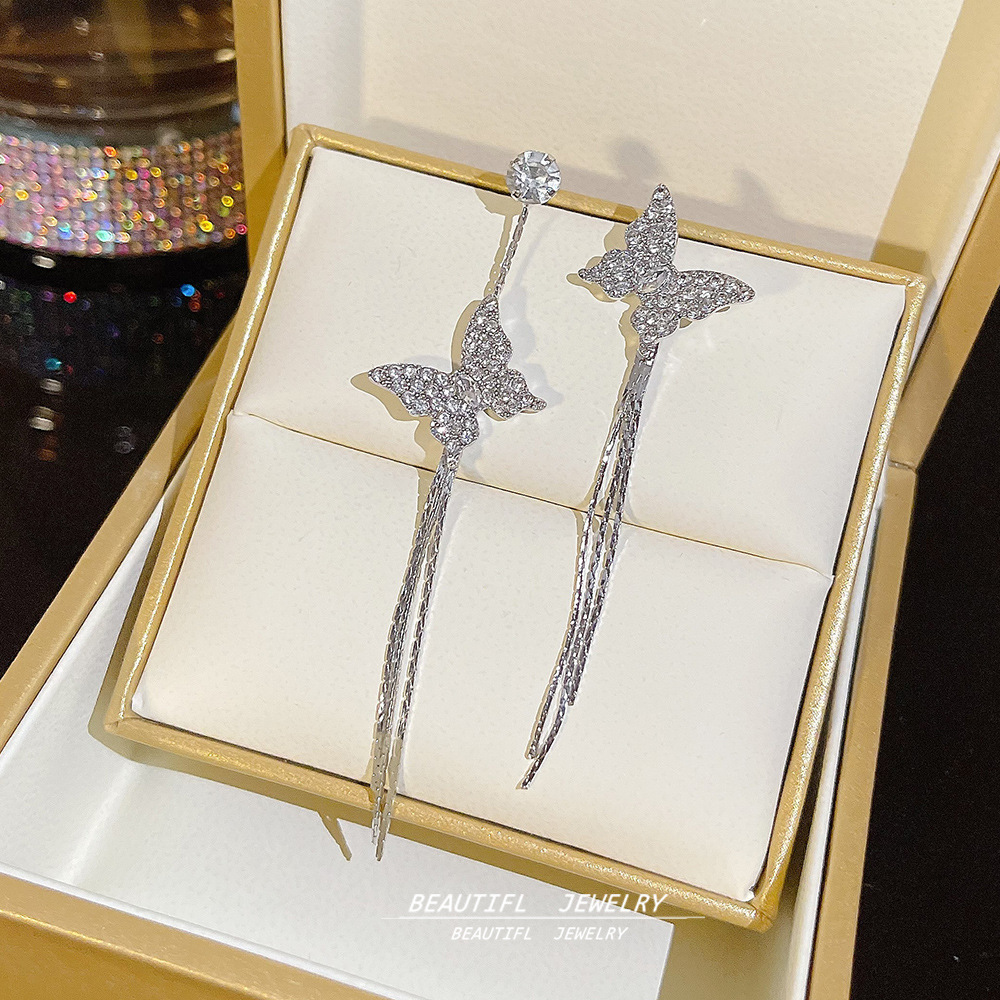 The new Korean-style ultra-sparkling asymmetrical butterfly tassel earrings feature a light luxury and niche design, which is simple and versatile full figure