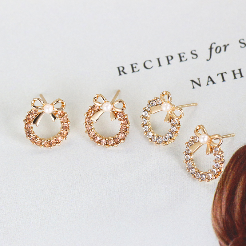European and American inS-style pearl bow stud earrings, women's unique and elegant style, studded with colorful diamonds, hollowed-out round earrings, cross-border earrings Application Scenario