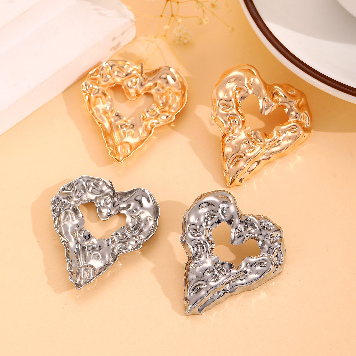 European and American pleated lava metal-textured hollowed-out heart-shaped stud earrings, unique, niche, elegant and high-end, exaggerated earrings for women Application Scenario