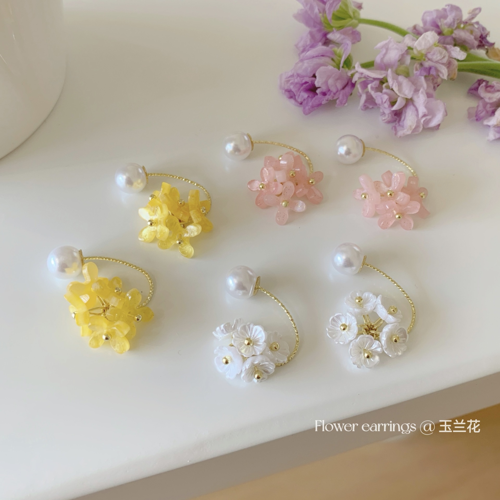 Spring and summer magnolia pearl resin earrings, with a light luxury and high-end feel, sweet and niche design, and a girlish heart, are exquisite earrings full figure