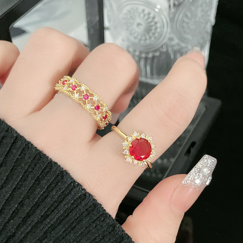 The new cross-border product, the hollowed-out red diamond personalized opening ring, is versatile and elegant in a cold style for women on Instagram. It's a trendy index finger ring that can make the skin look fairer details Picture