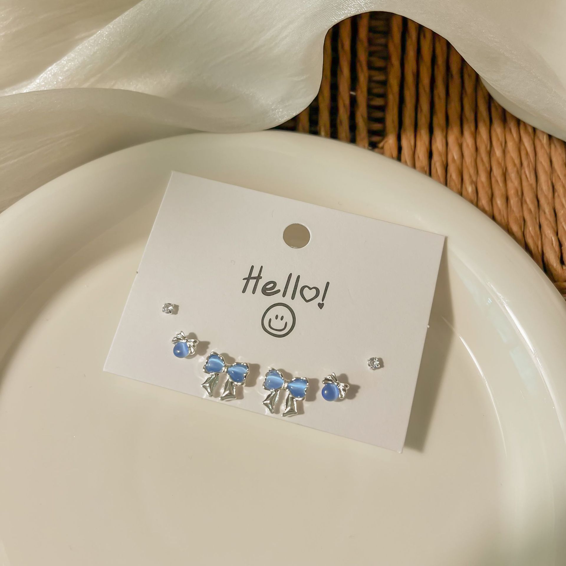 Silver needle blue cat's eye stone bow, a niche set of ear studs for women, simple and versatile design, trendy, sweet and cool earrings wholesale details Picture
