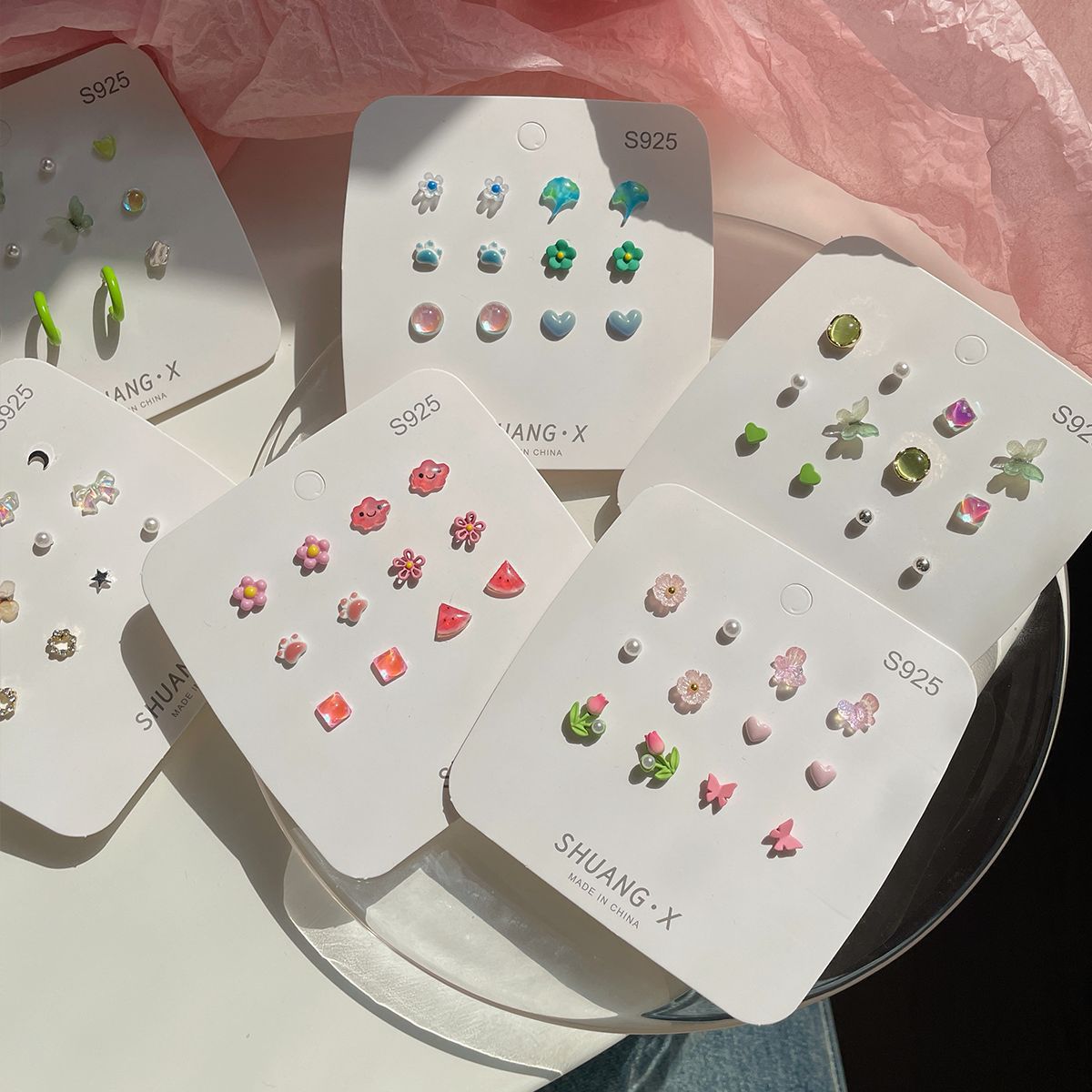 Fresh small stud earrings, no repetition for a week collection of stud earrings, women's silver needle, small and exquisite floral earrings wholesale in Yiwu Application Scenario