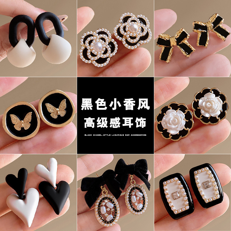 Korean Xiaoxiangqi quality earrings, women's flower stud earrings, simple, individual, trendy and retro camellia flower earrings and stud earrings wholesale full figure