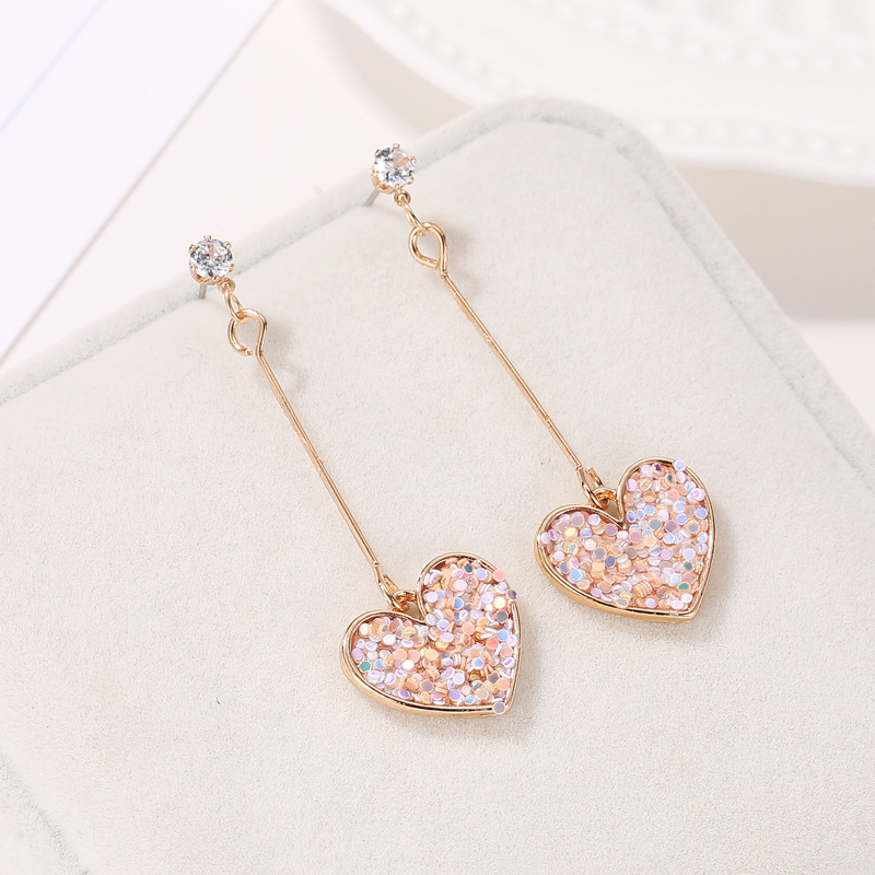Korean-style fresh and cute heart-shaped tassel stud earrings, sweet Internet celebrity style, colorful earrings, fashionable and versatile, trendy accessories wholesale Application Scenario