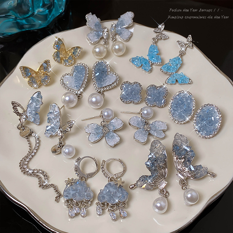 Super ethereal blue butterfly stud earrings for women, 2024 new bestseller earrings, niche, light luxury, high-end and elegant pearl earrings full figure