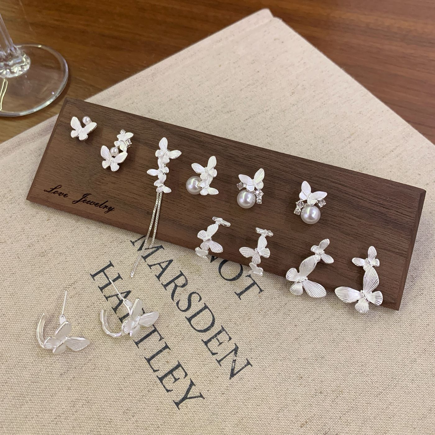 A collection of Korean-style ethereal silver butterfly stud earrings, simple and versatile silver needles for women, elegant and high-end fringed insect earrings Application Scenario