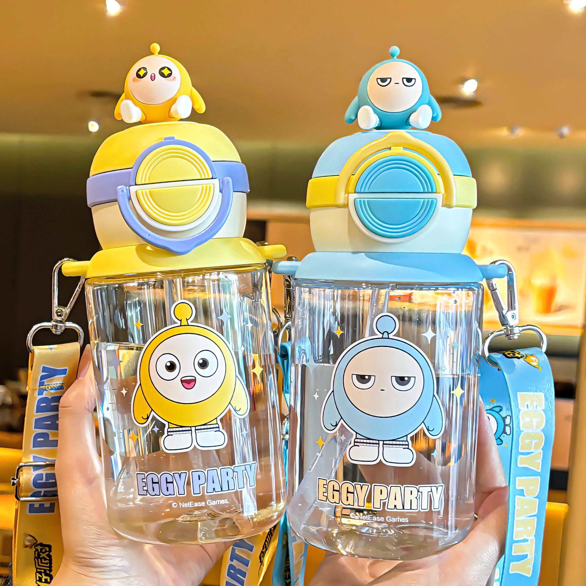 Egg Doll Party pop-up lid plastic cup with a cup rope for easy carrying. Independent doll lock design drinking cup Application Scenario