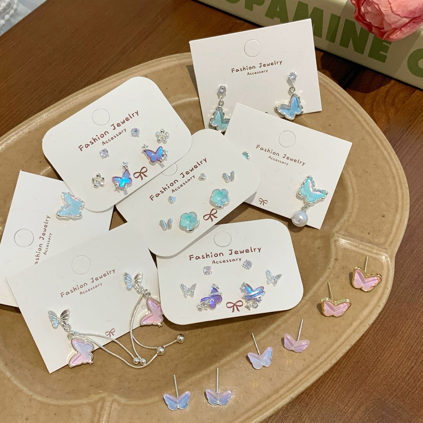 Summer sea salt laser ice-transparent butterfly earrings, women's silver needle, niche, ethereal, sweet and fresh style earrings wholesale Application Scenario
