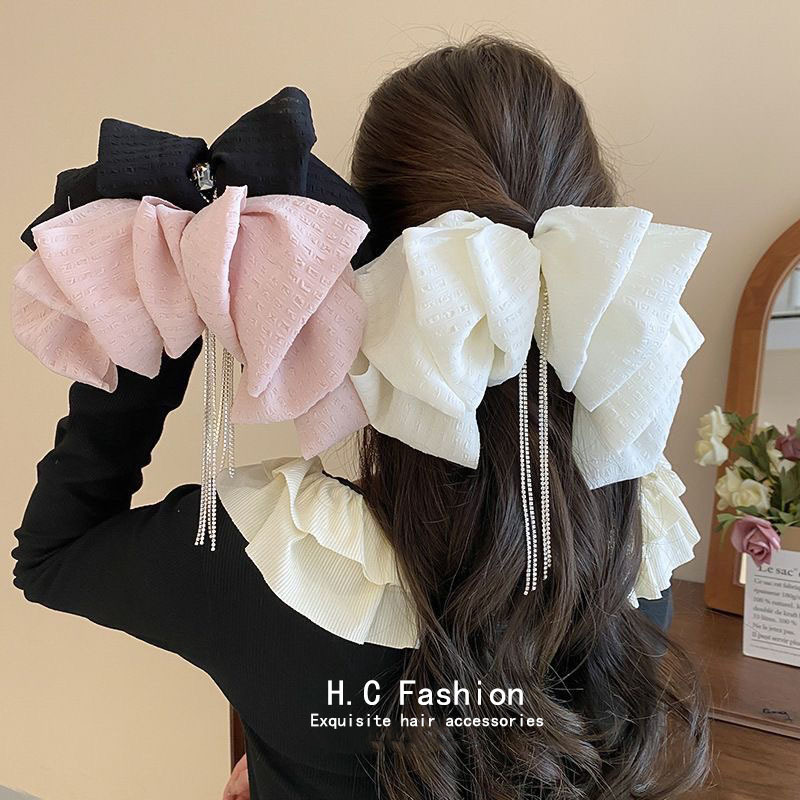 Retro tassel ribbon cloud semi-tied hair spring clip for women, new hair accessory that makes the face look small, back of the head hair clip full figure