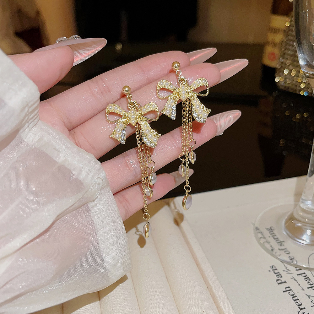 Korean-style long bow tassel earrings, high-end autumn and winter earrings, versatile and elegant pearl stud accessories for women details Picture