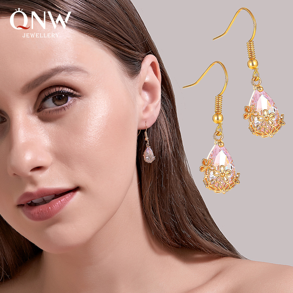 European and American InS-style zircon water drop earrings, a creative design with a unique female personality and temperament, and hollowed-out flower earrings, are popular earrings full figure