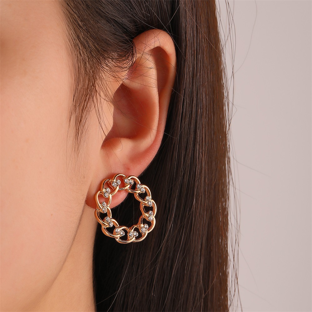 European and American InS-style twisted round stud earrings, women's unique and elegant hollowed-out diamond-encrusted geometric earrings, cross-border best-selling earrings full figure