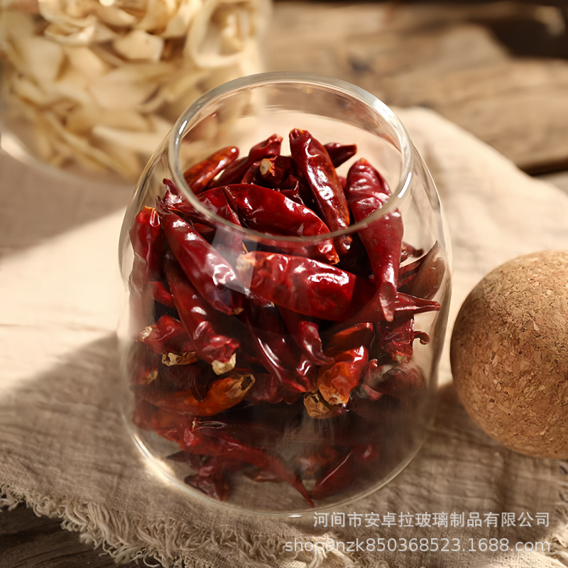The manufacturer supplies food-grade transparent glass storage tanks with cork stoppers for coffee beans, snacks, and grains Application Scenario
