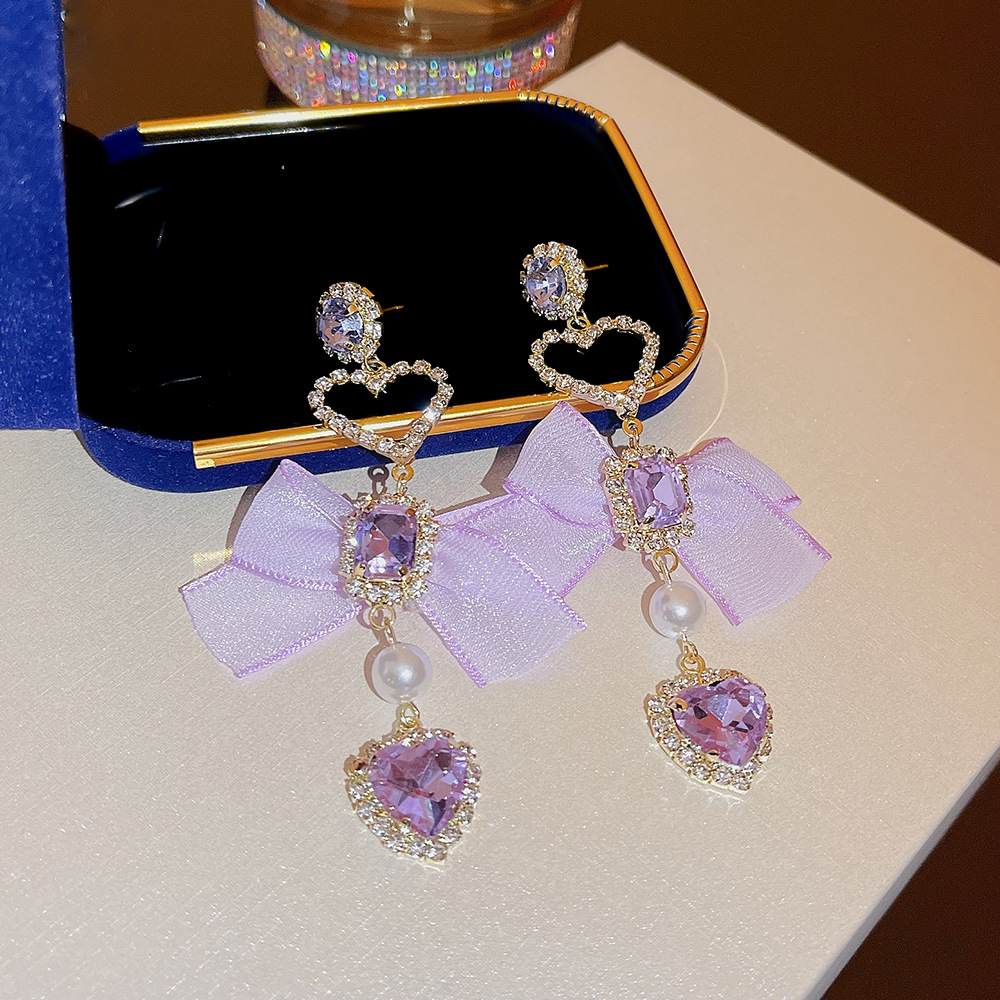 Korean-style long, exquisite heart-shaped bow tassel earrings, nightclub socialite style, light luxury design sense earrings for women full figure