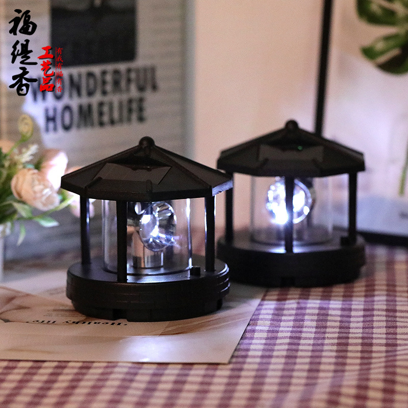 Cross-border LED solar rotating lighthouse resin accessories outdoor courtyard garden lawn decorative lighting landscape lights full figure