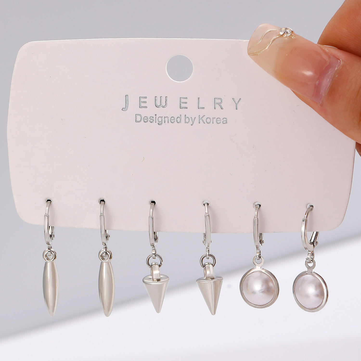 European and American cross-border earrings, fashionable and simple ear ring and ear buckle set, pointed cone rivets, water drop cross, star earrings for women Specification drawing