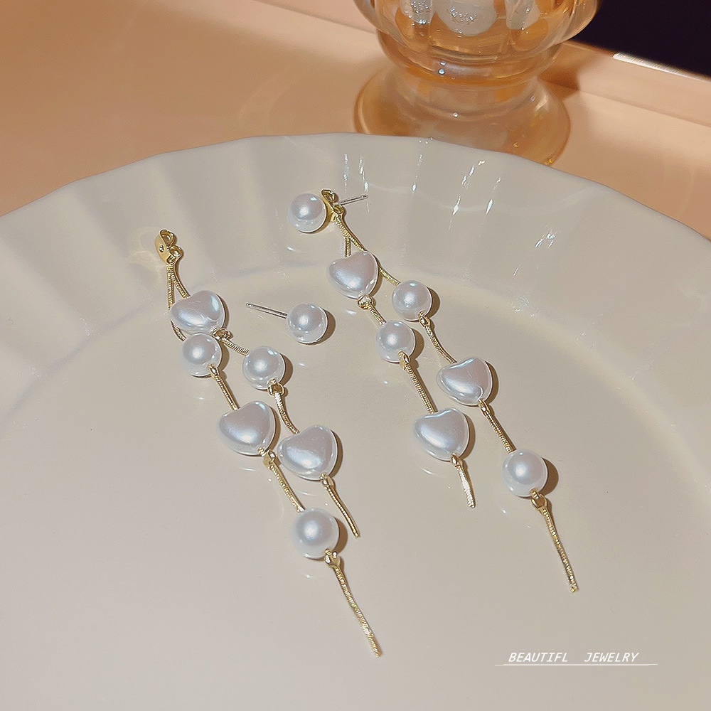 Luxurious heart-shaped pearl tassel earrings for socialites, with a unique design sense, versatile and exquisite earrings, and a high-end feel. Super fairy-like earrings Application Scenario