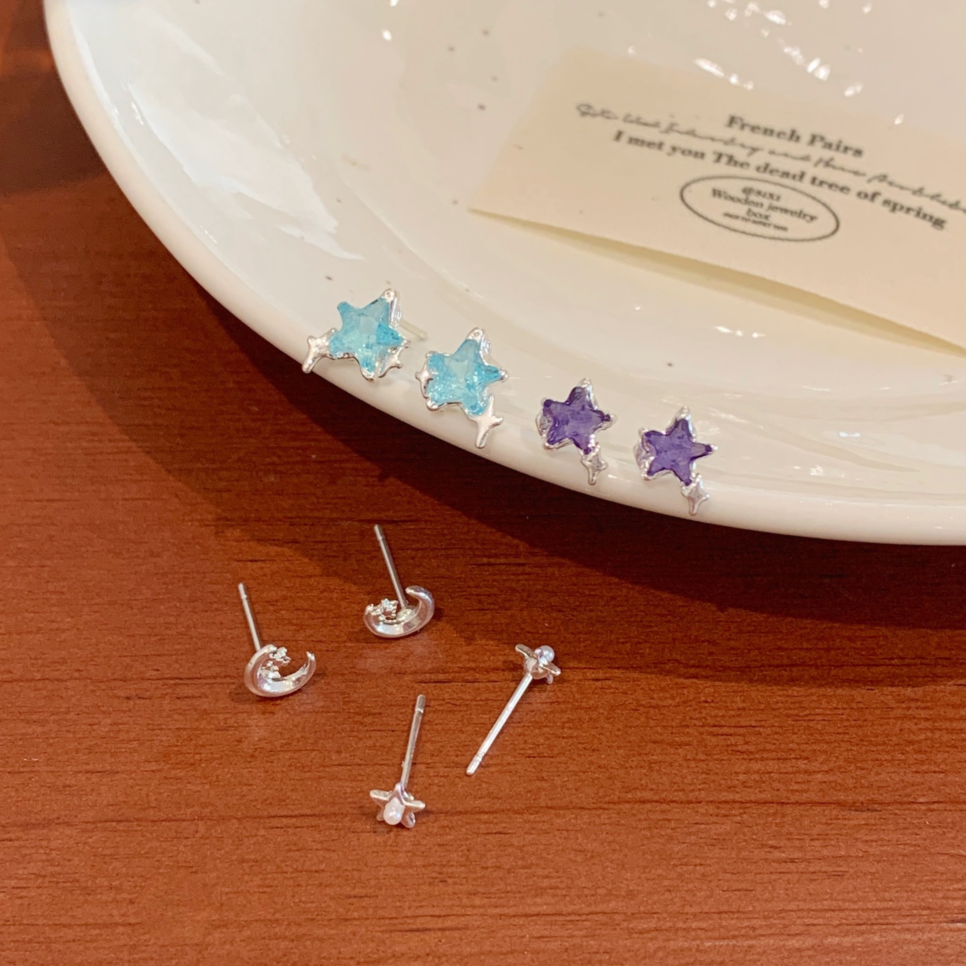 Blue zircon five-pointed star moon stud earrings, silver needle for women, small design sense, simple and elegant ear-piercing, student earrings details Picture