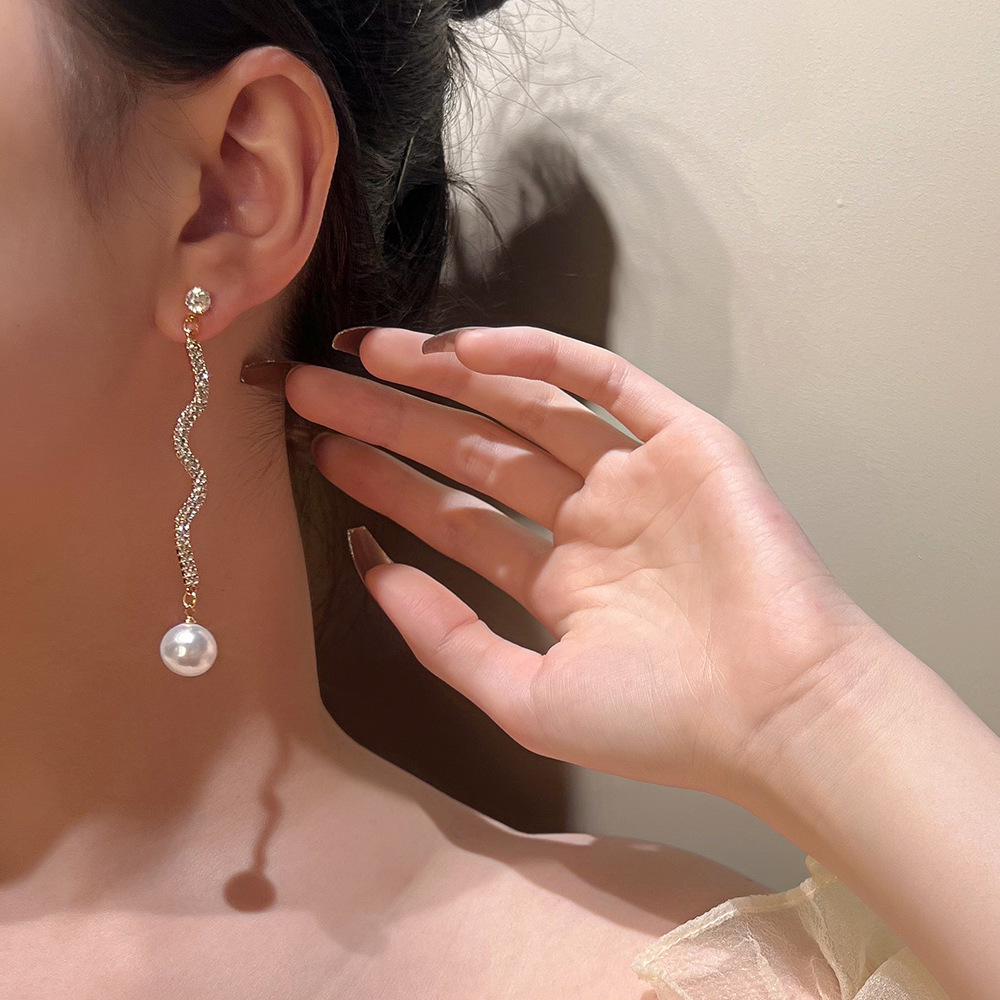 European and American ins long pearl rhinestone earrings and pendants, fashionable Korean wavy S-curve stud earrings, and personalized and exaggerated earrings full figure